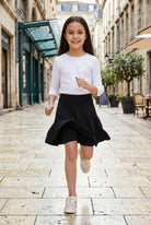 Model wearing Nuggles®  Girl's Athleisure Skirt in Black