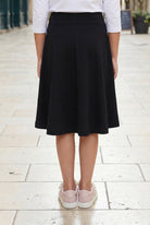 Model wearing Nuggles®  Girl's Athleisure Skirt in Black