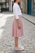 Model wearing Nuggles®  Girl's Athleisure Skirt in Dusty Pink