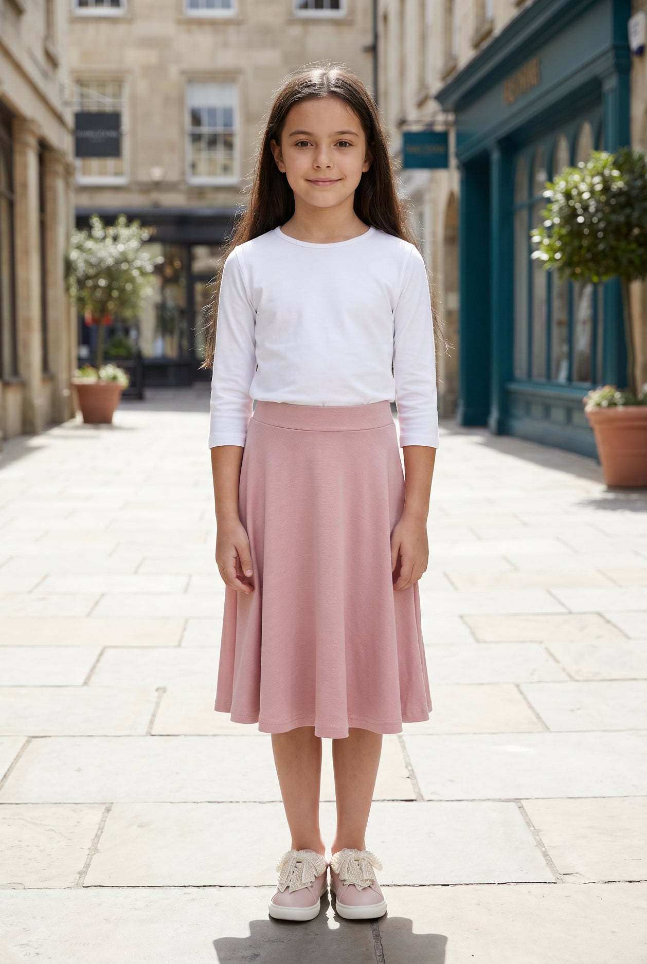 Model wearing Nuggles®  Girl's Athleisure Skirt in Dusty Pink