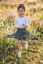 Model wearing Nuggles®  Girls' Athleisure Skirt
