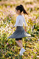 Model wearing Nuggles®  Girls' Athleisure Skirt
