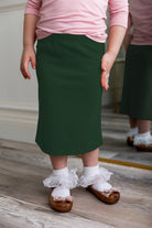 Modest girls' classic midi skirt with soft elastic waistband, knee-length fit, and durable fabric – perfect for everyday wear.