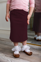 Modest girls' classic midi skirt with soft elastic waistband, knee-length fit, and durable fabric – perfect for everyday wear.