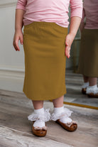 Modest girls' classic midi skirt with soft elastic waistband, knee-length fit, and durable fabric – perfect for everyday wear.