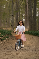 Model wearing Nuggles®  Girl's Athleisure Skirt in Dusty Pink
