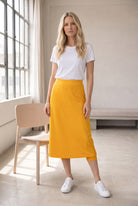 Model wearing Nuggles®  31" Sport Skirt in Gold