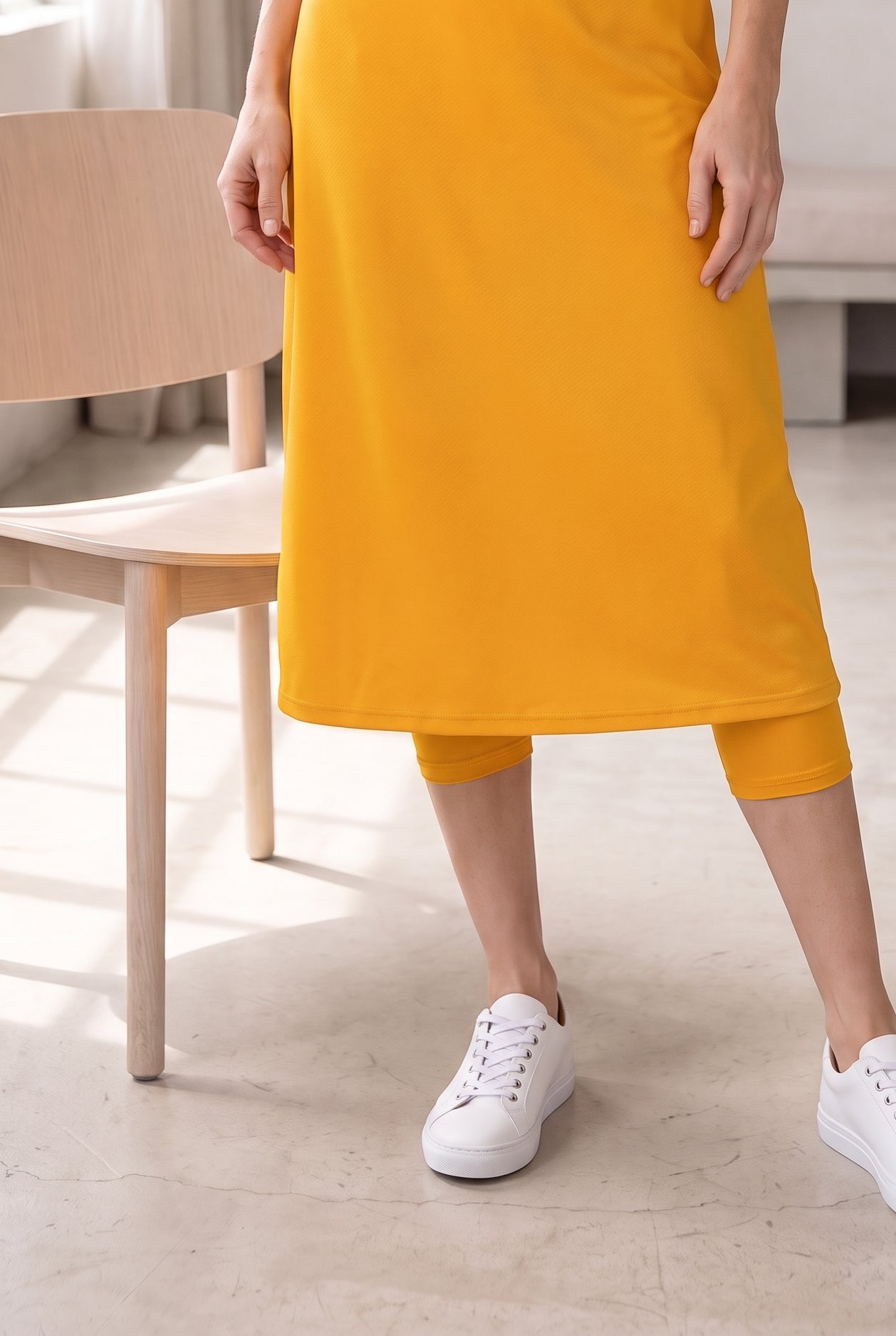 Model wearing Nuggles®  31" Sport Skirt in Gold