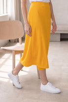 Model wearing Nuggles®  31" Sport Skirt in Gold