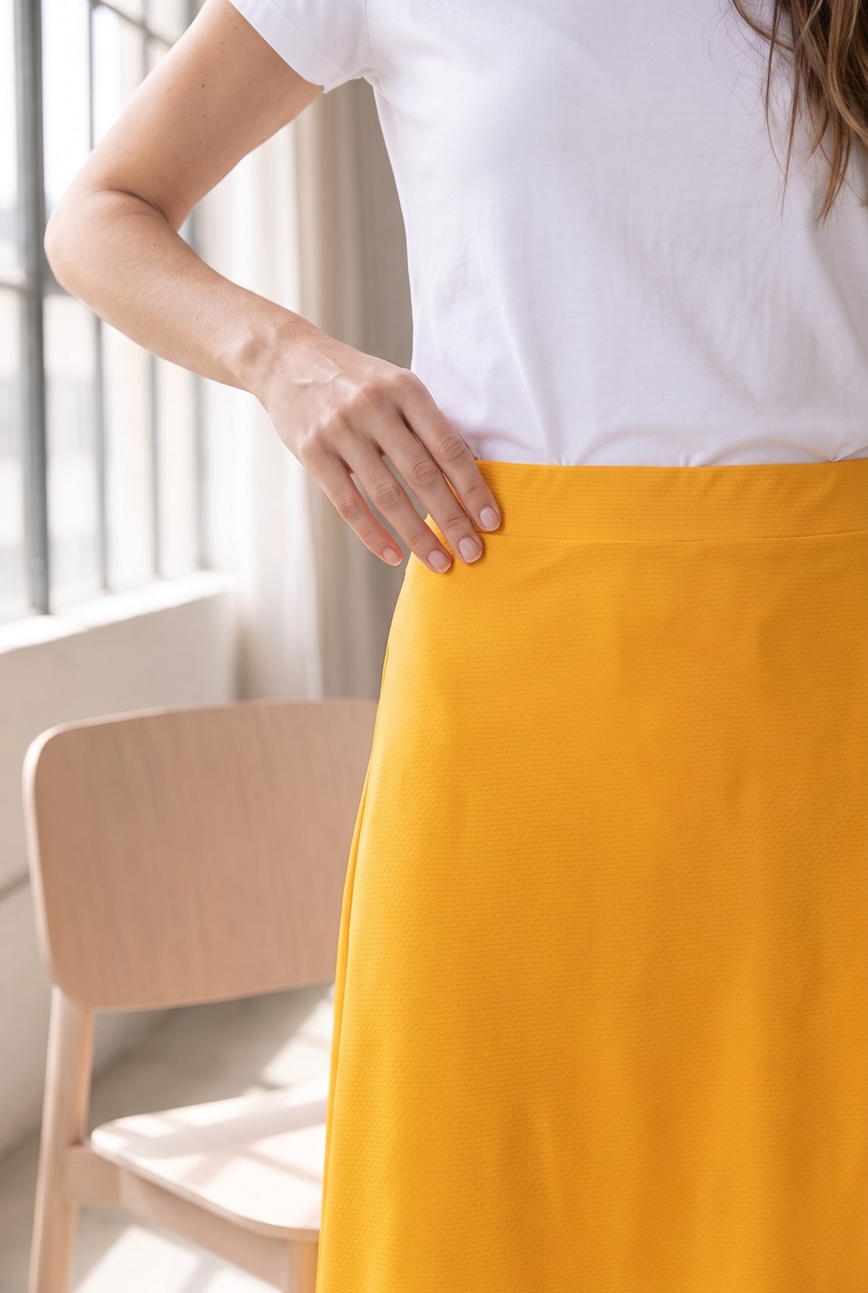 Model wearing Nuggles®  31" Sport Skirt in Gold