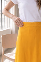 Model wearing Nuggles®  31" Sport Skirt in Gold