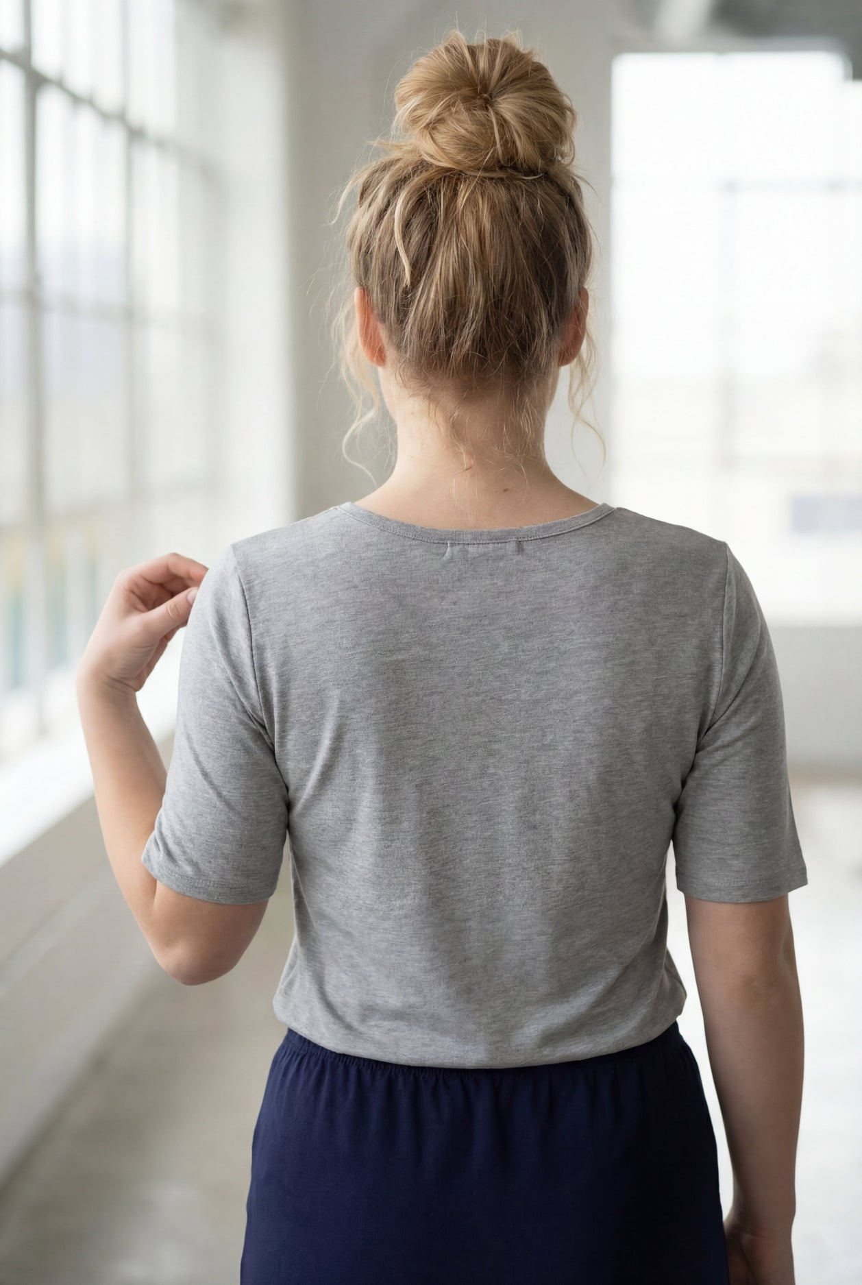Model wearing Nuggles® Half Sleeve Essential Tee in Light Heather