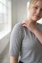 Model wearing Nuggles® Half Sleeve Essential Tee in Light Heather