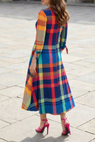 Model wearing Nuggles® Gracie Dress in Harvest Plaid