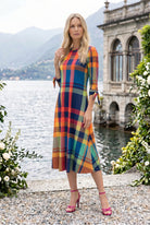 Model wearing Nuggles® Gracie Dress in Harvest Plaid