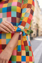 Model wearing Nuggles®  Hazel Dress in Retro Mosaic
