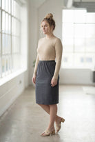 Model wearing Nuggles® 25" Classic Skirt in Heather Gray