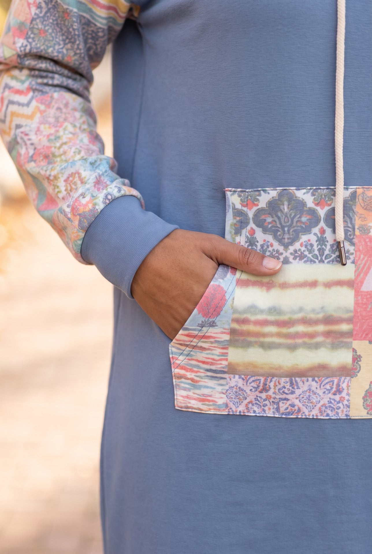 Model wearing Nuggles®  Hoodie Dress in Boho Mosaic
