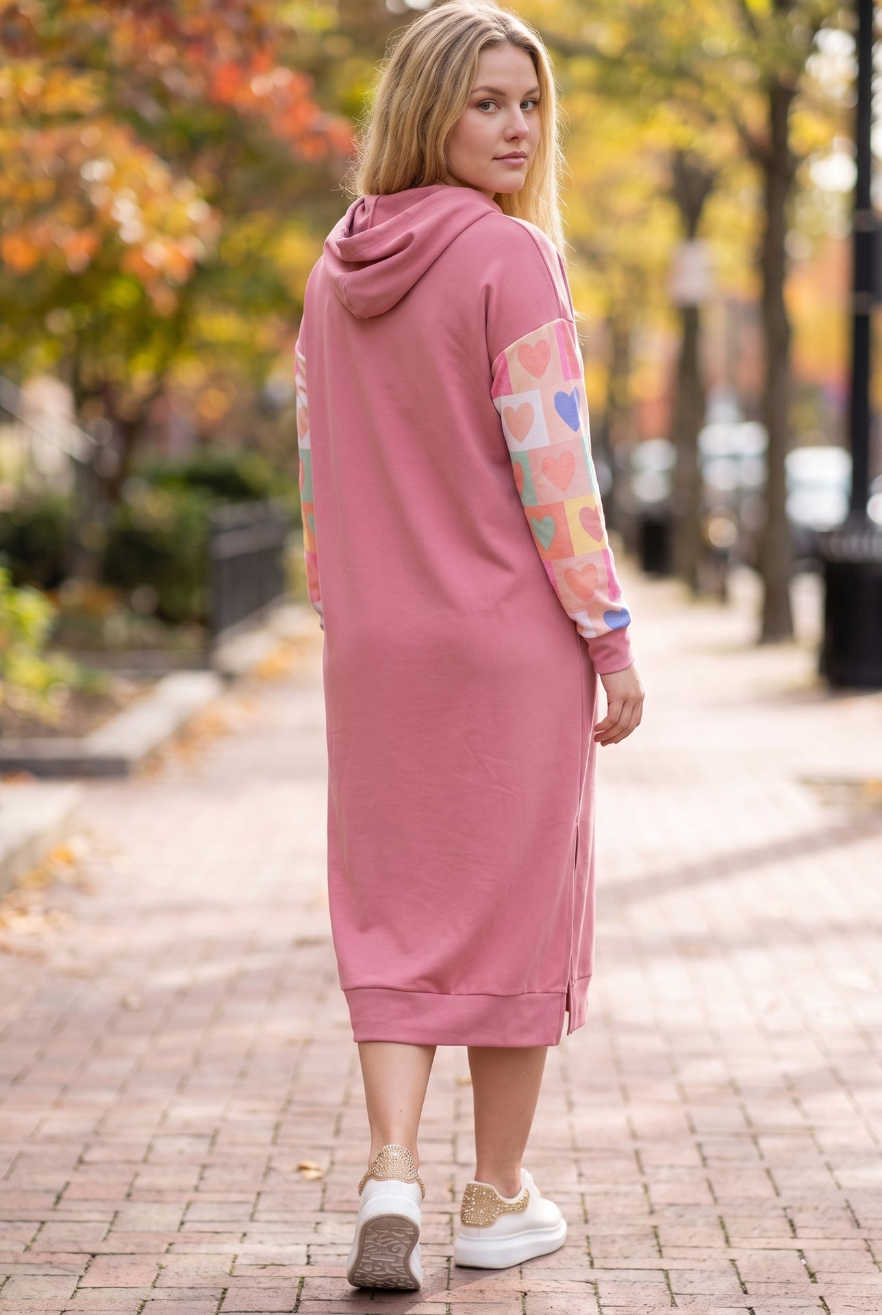 Model wearing Nuggles®  Hoodie Dress in Candy Hearts
