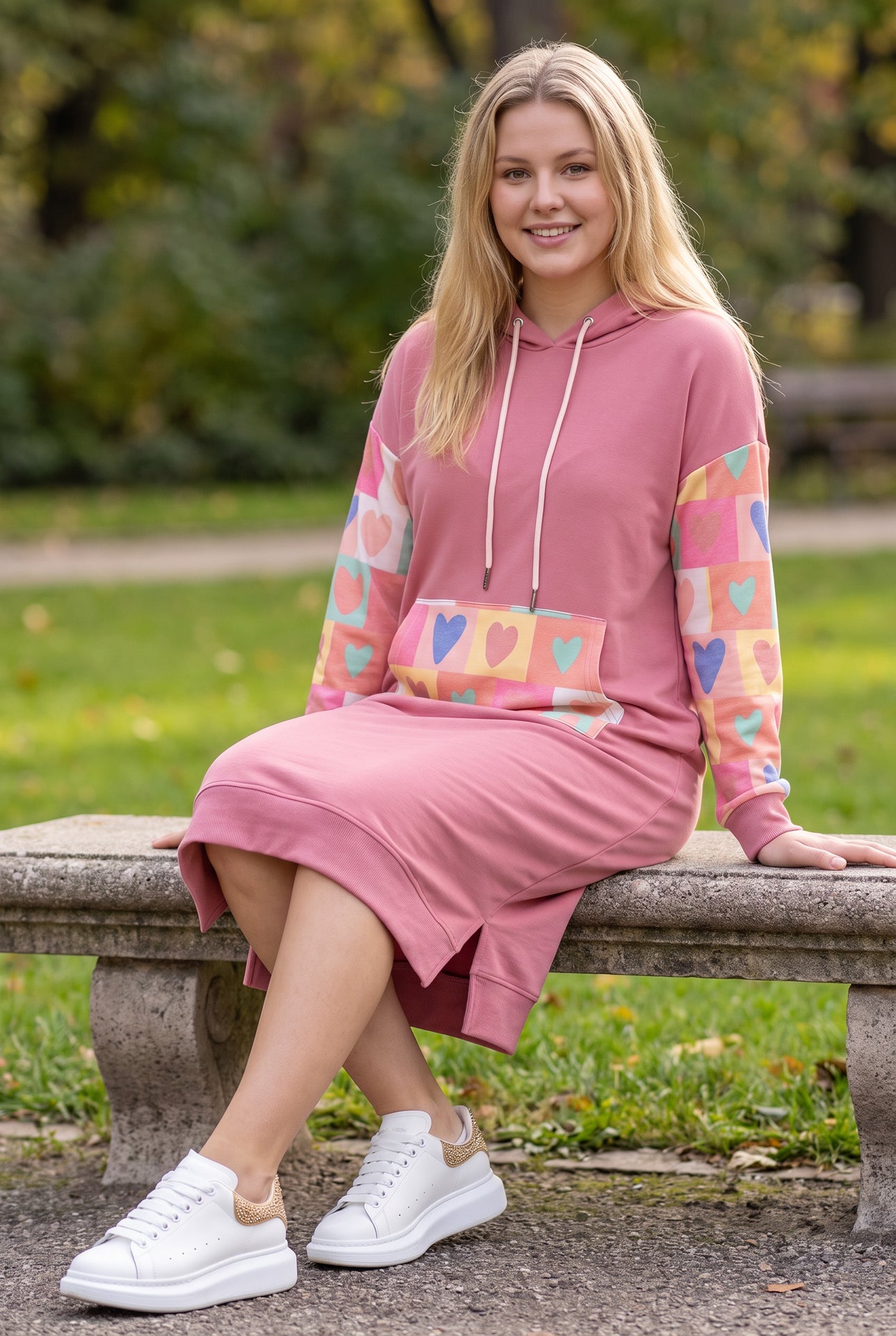 Model wearing Nuggles®  Hoodie Dress in Candy Hearts

