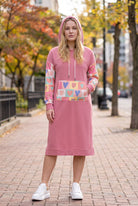 Model wearing Nuggles®  Hoodie Dress in Candy Hearts
