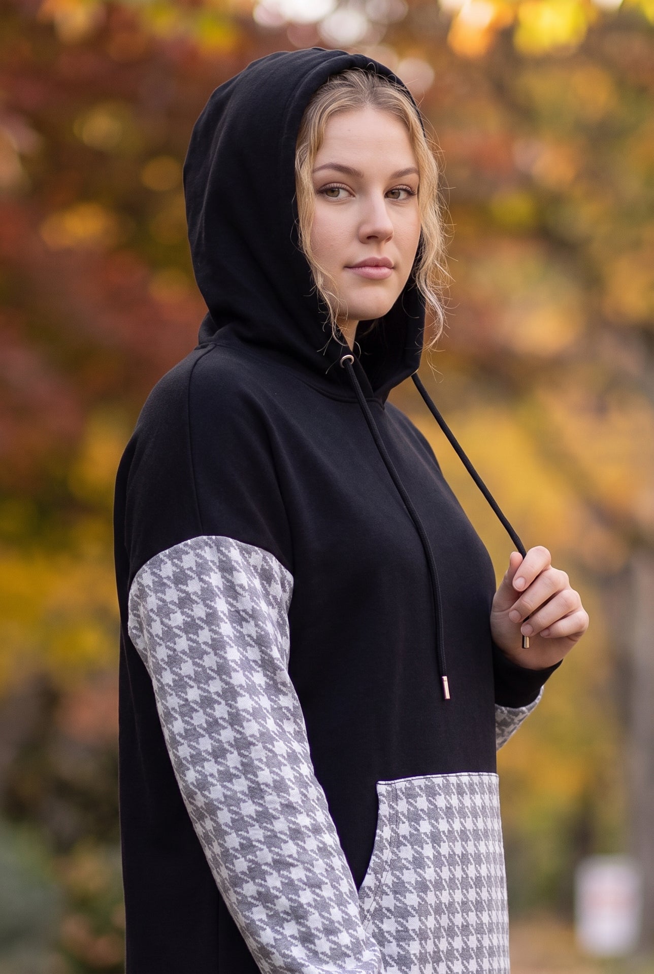 Model wearing Nuggles®  Hoodie Dress in Cookie Check
