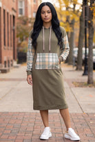 Model wearing Nuggles®  Hoodie Dress in Olive Plaid