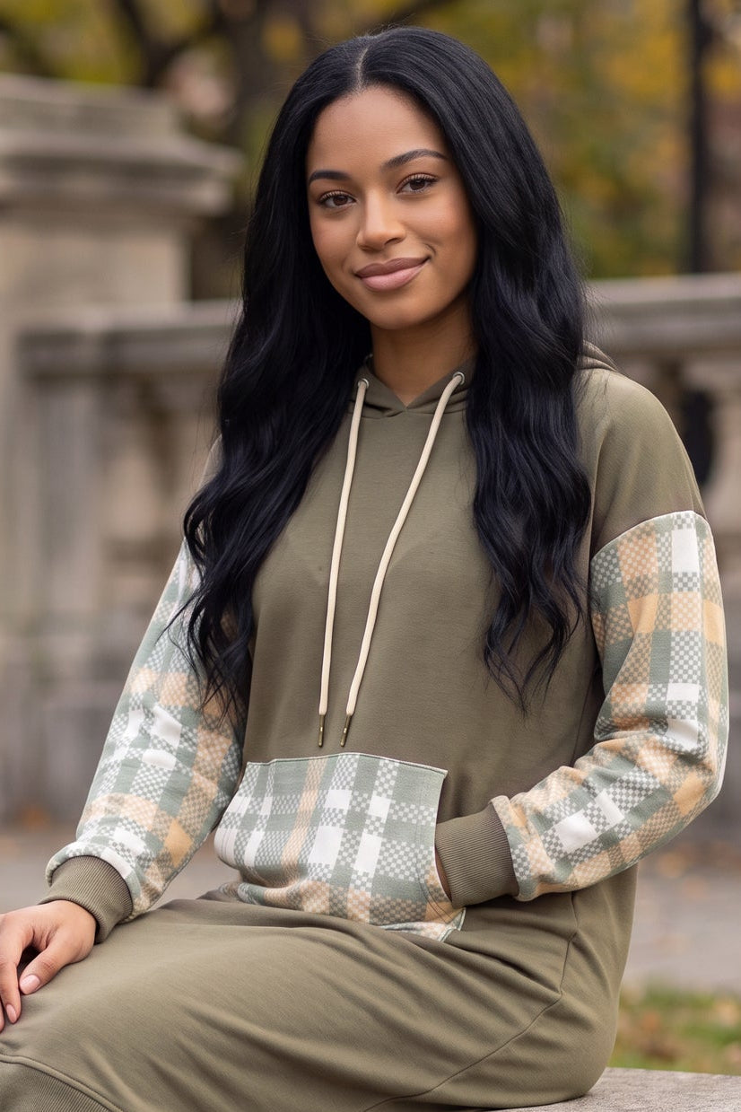Model wearing Nuggles®  Hoodie Dress in Olive Plaid