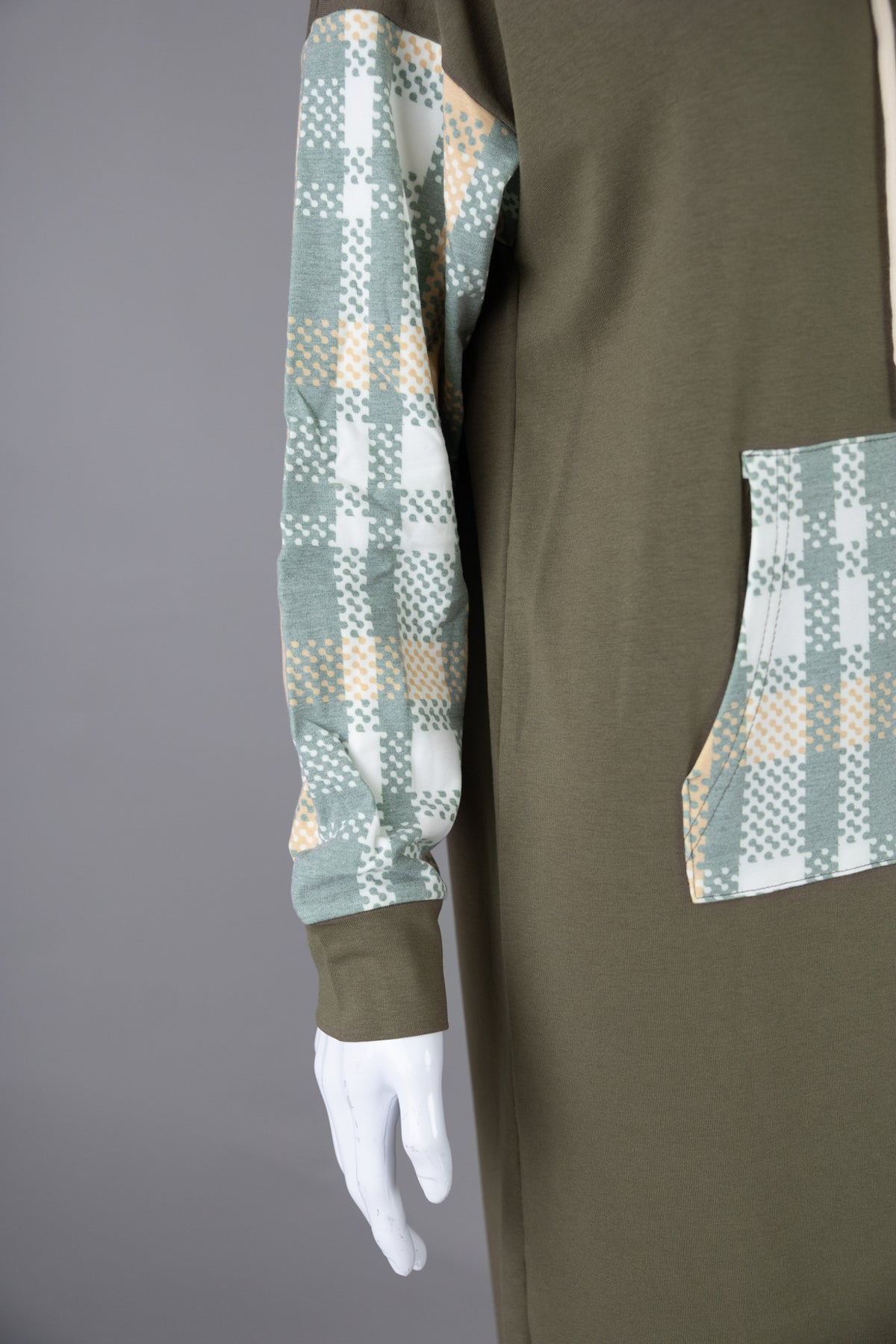 Model wearing Nuggles®  Hoodie Dress in Olive Plaid