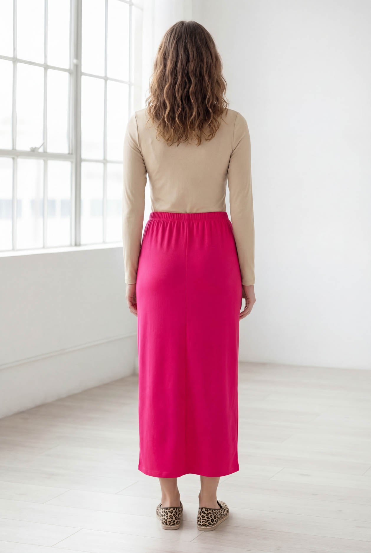 Model wearing Nuggles® 36" Classic Skirt in Hot Pink