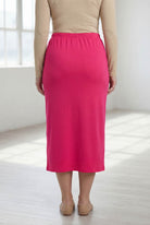 Model wearing Nuggles® 31" Classic Skirt in Hot Pink