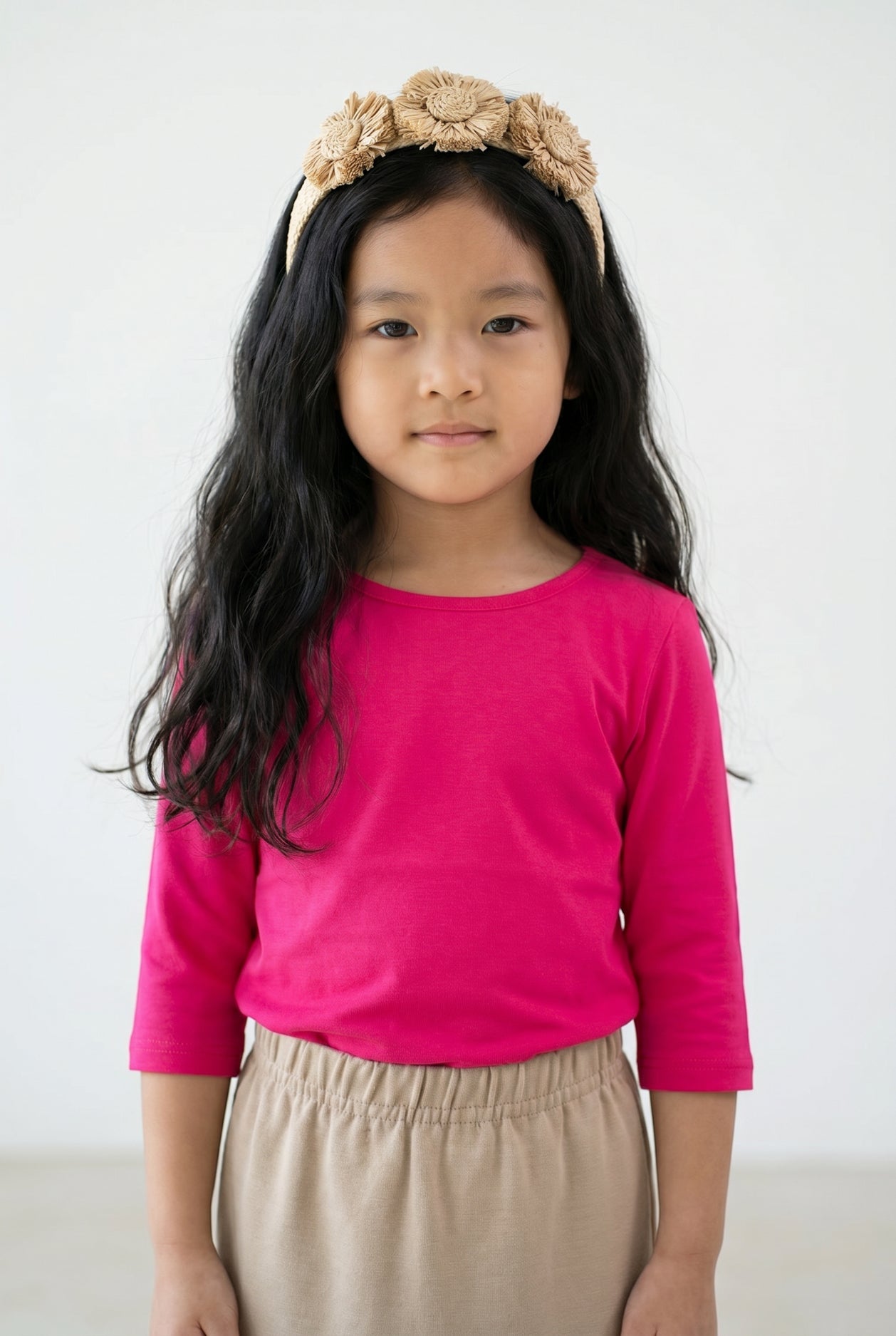 Model wearing the Girls' Nuggles® 3/4 Essential Tee in Hot Pink