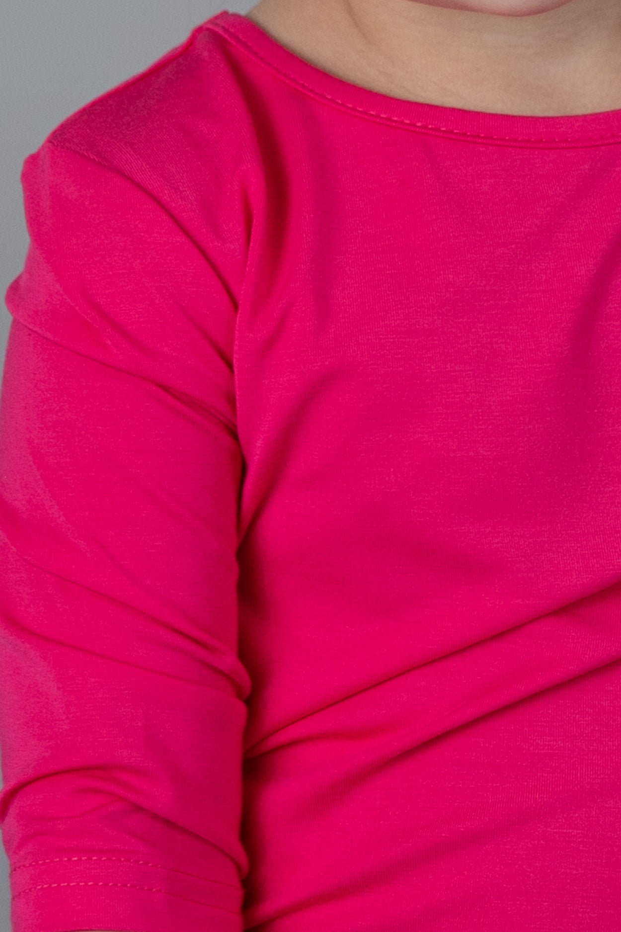 Model wearing the Girls' Nuggles® 3/4 Essential Tee in Hot Pink