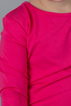 Model wearing the Girls' Nuggles® 3/4 Essential Tee in Hot Pink