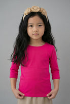Model wearing the Girls' Nuggles® 3/4 Essential Tee in Hot Pink