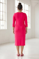 Model wearing Nuggles® Midi Layering Dress in Hot Pink