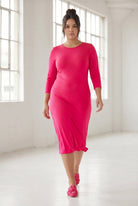 Model wearing Nuggles® Midi Layering Dress in Hot Pink