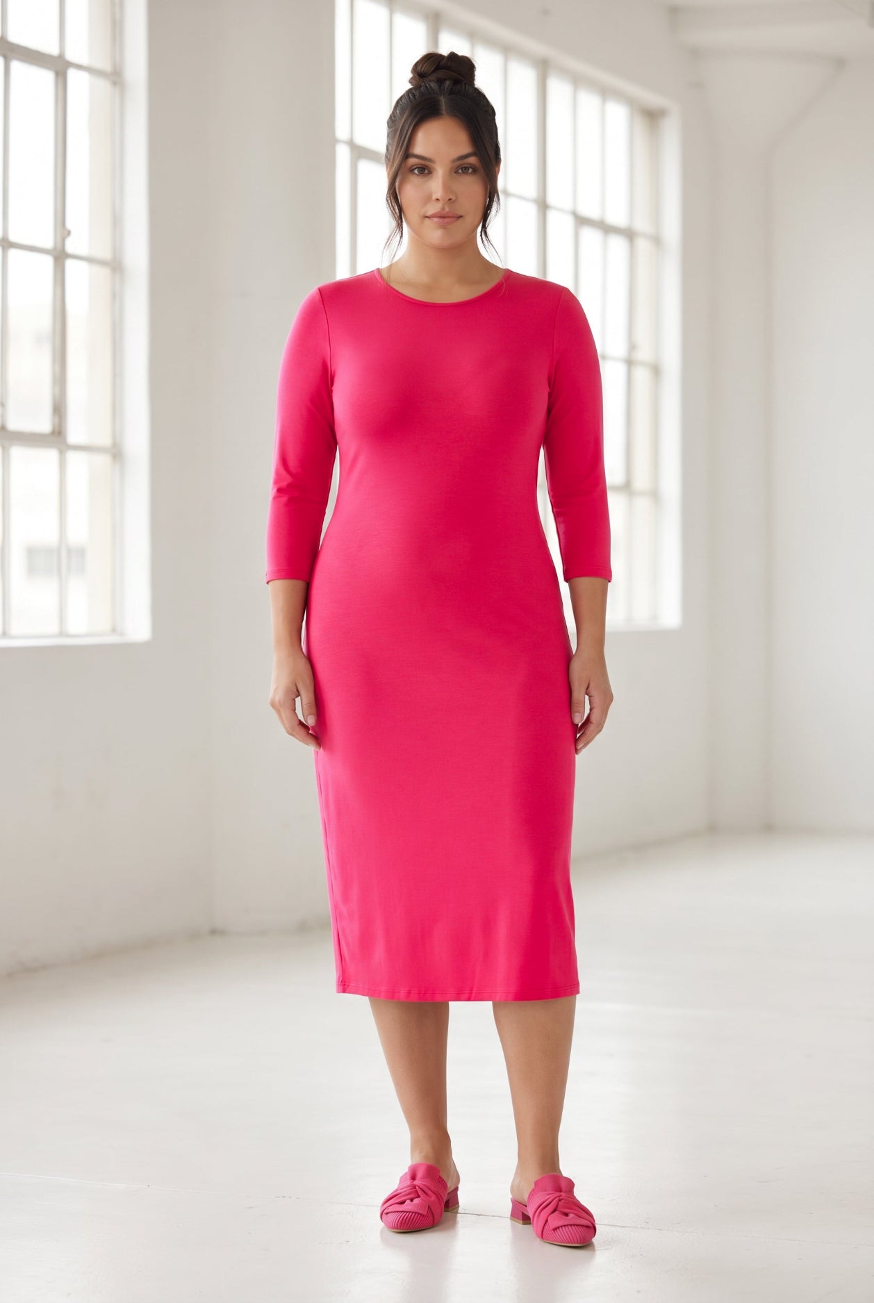 Model wearing Nuggles® Midi Layering Dress in Hot Pink