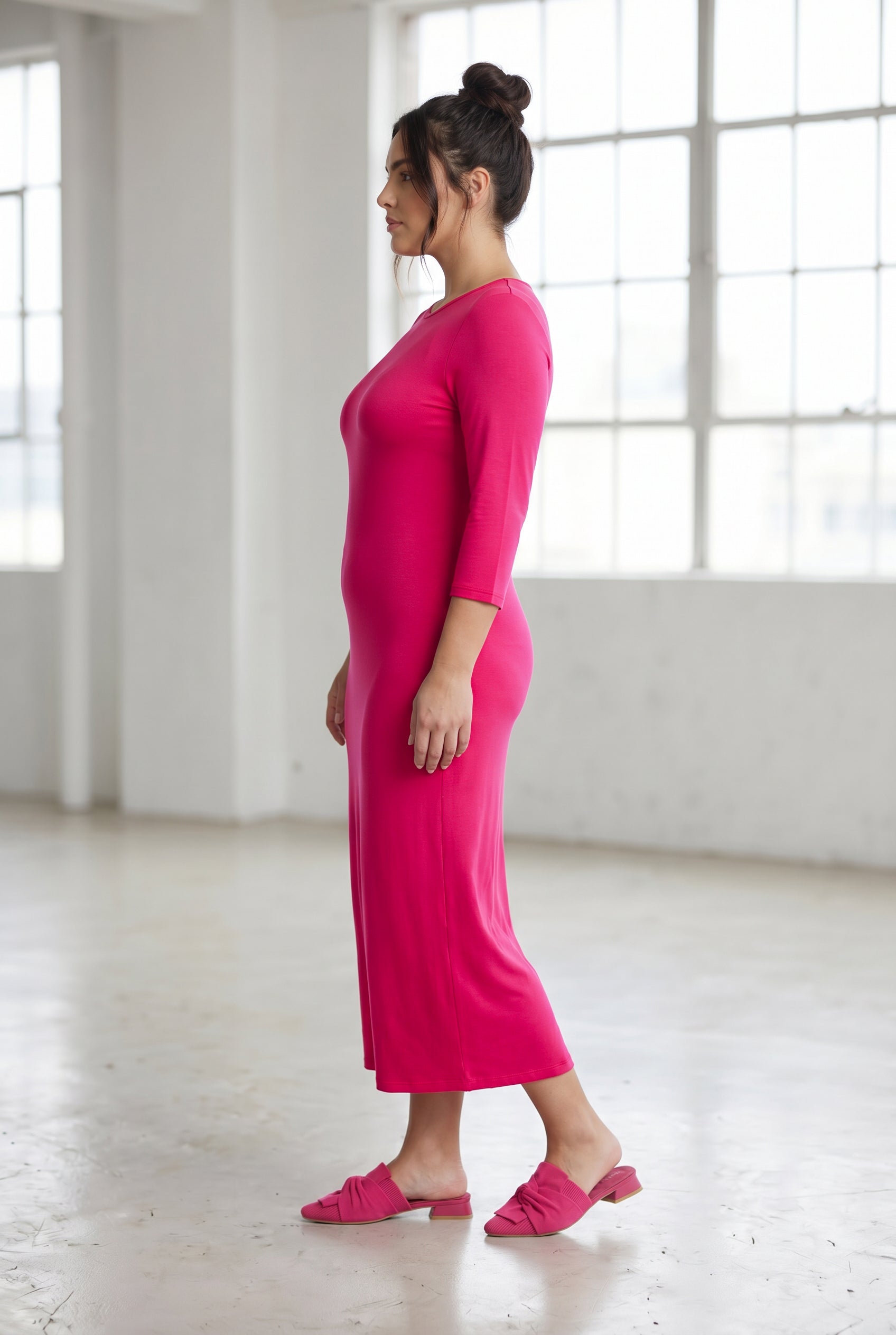 Model wearing Nuggles® Tea Layering Dress in Hot Pink