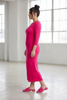 Model wearing Nuggles® Tea Layering Dress in Hot Pink
