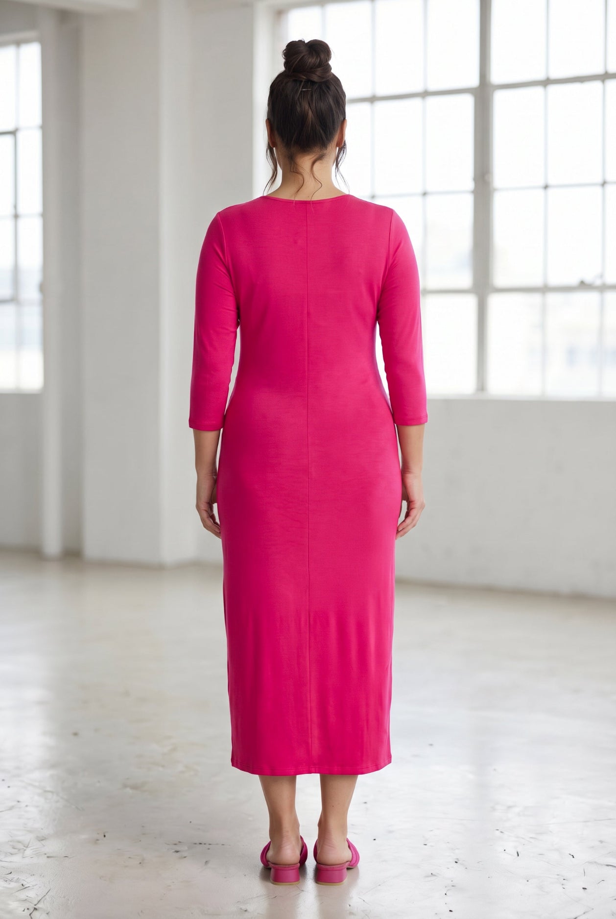 Model wearing Nuggles® Tea Layering Dress in Hot Pink