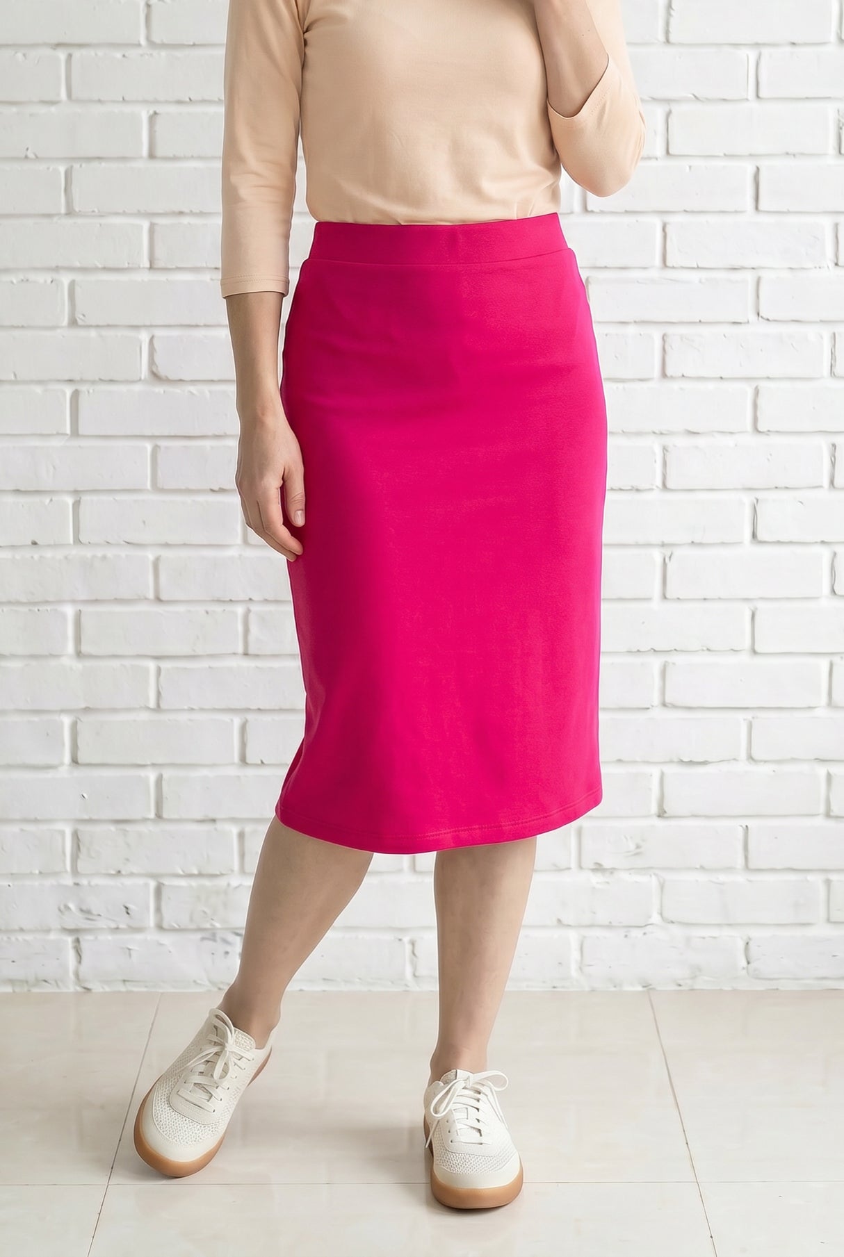 Model wearing Nuggles® 27" Relaxed Skirt in Hot Pink