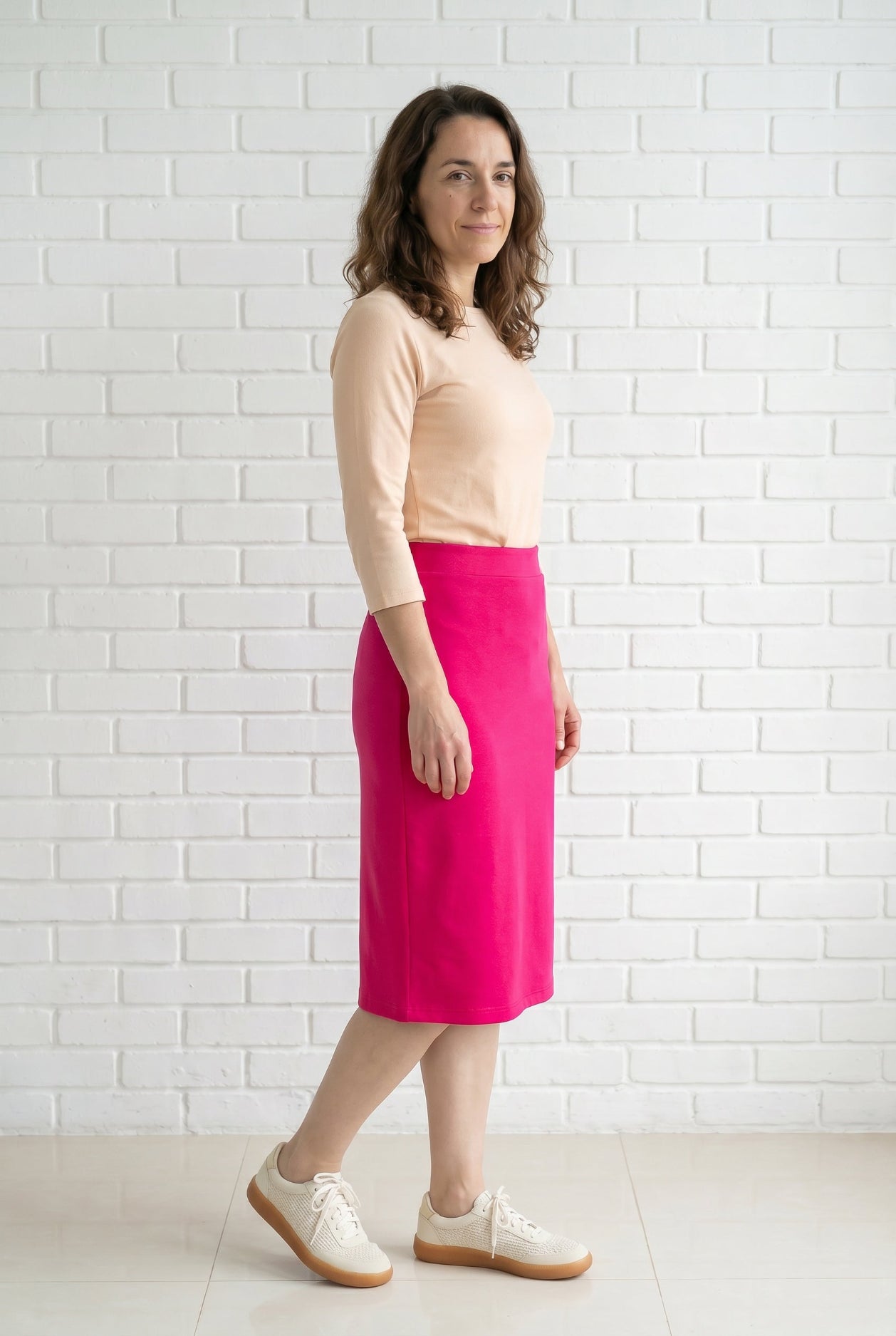 Model wearing Nuggles® 27" Relaxed Skirt in Hot Pink