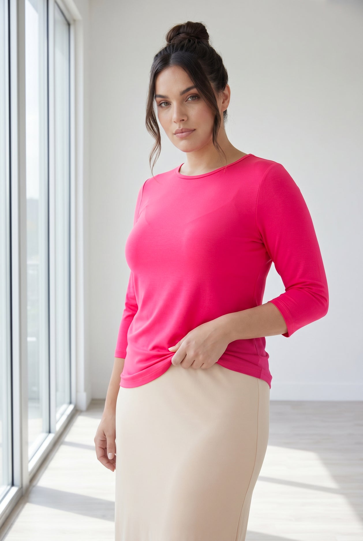 Model wearing Nuggles® 3/4 Essential Tee in Hot Pink