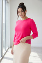 Model wearing Nuggles® 3/4 Essential Tee in Hot Pink