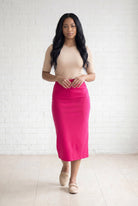 Model wearing Nuggles® 31" Relaxed Skirt in Hot Pink