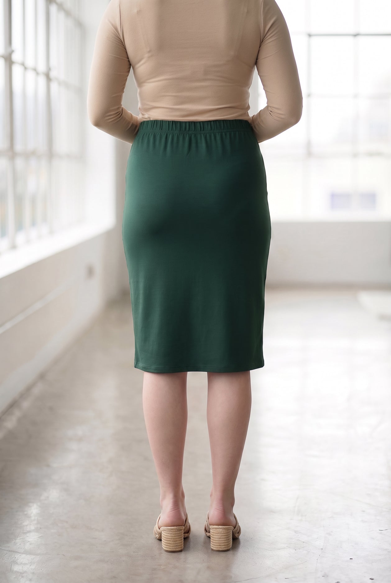 Model wearing Nuggles® 27" Classic Skirt in Hunter Green