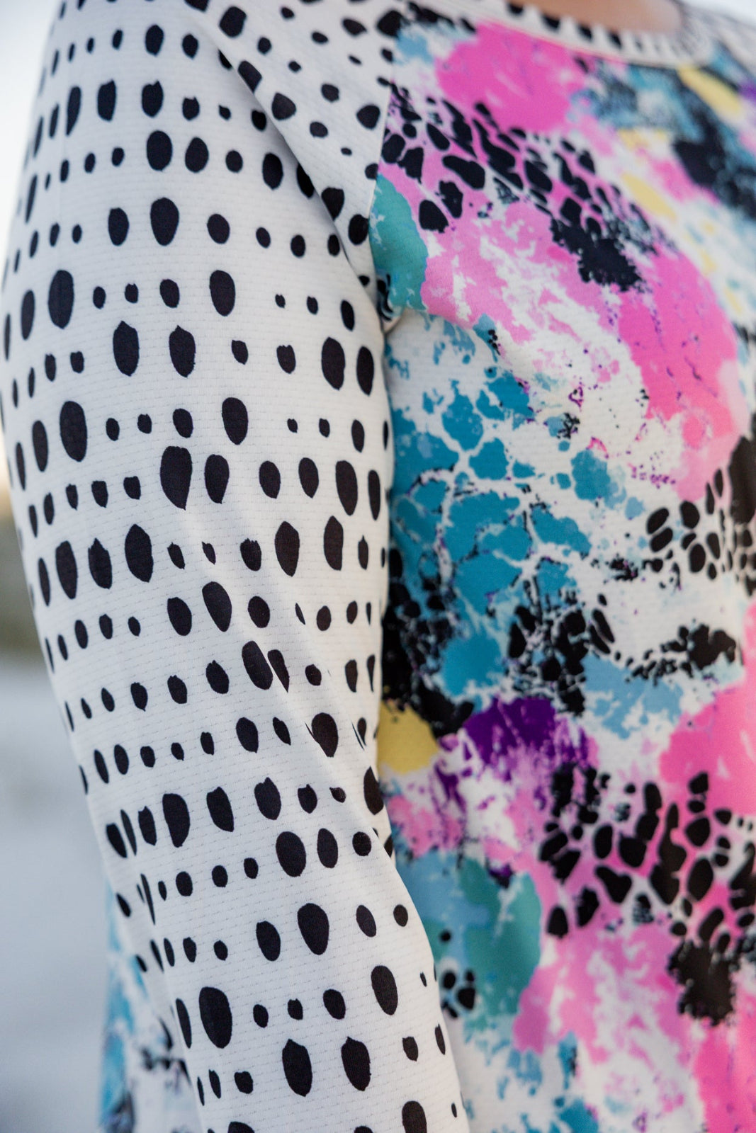 Model wearing Nuggles® Sport Swim Dress in Watercolor Blossom