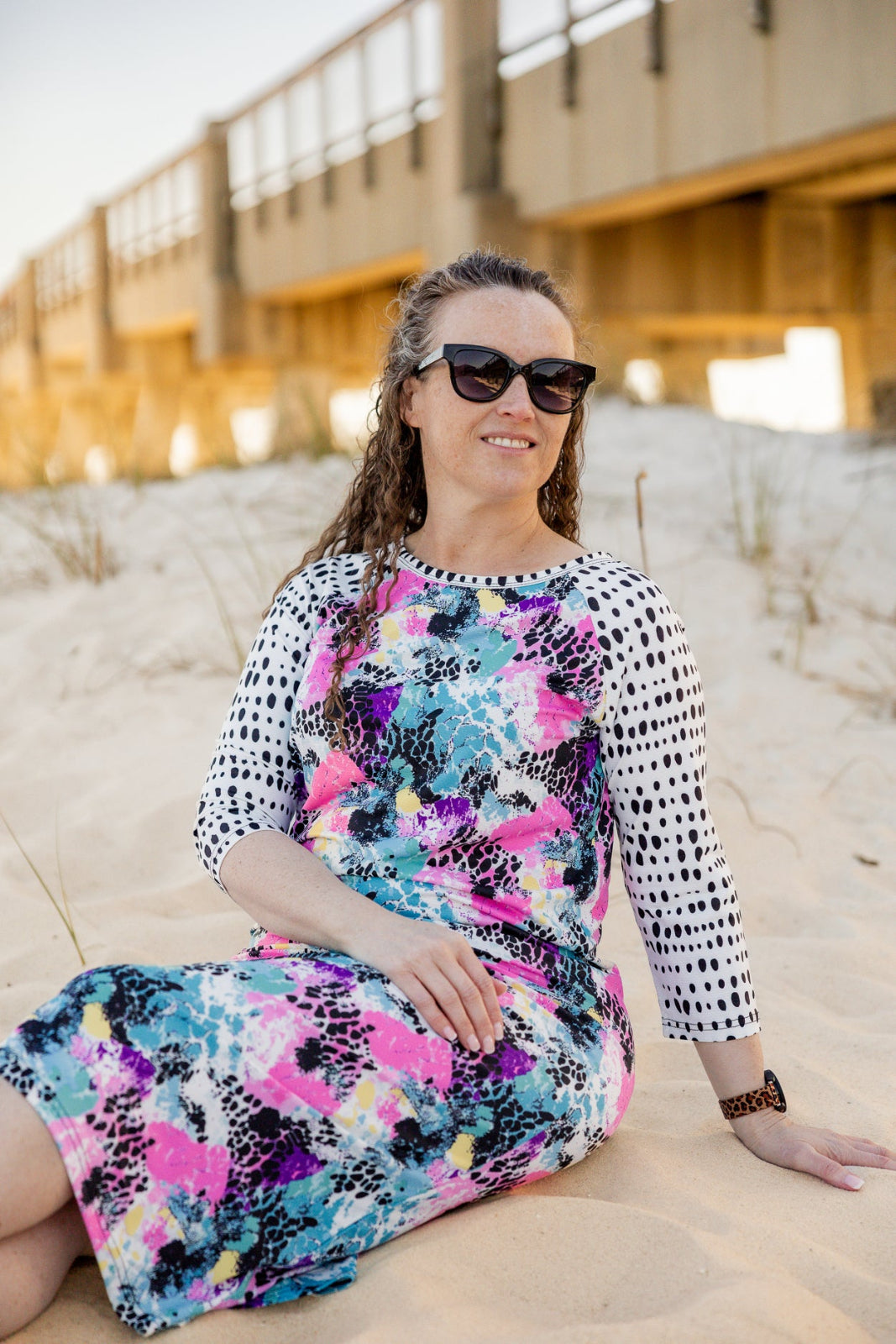 Model wearing Nuggles® Sport Swim Dress in Watercolor Blossom