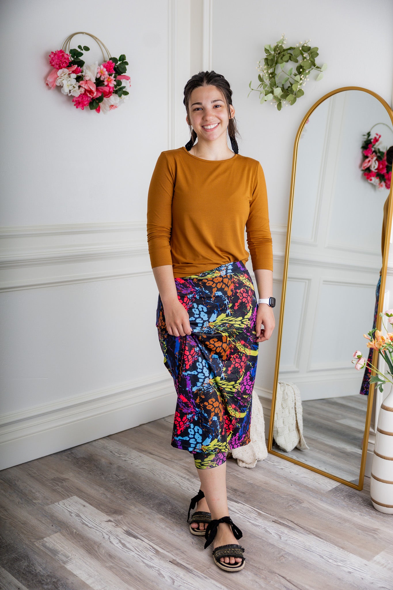 Woman wearing 27-inch tropical flower modest sport skirt with built-in leggings—ideal for activewear, cycling, running, swimming, and workouts.